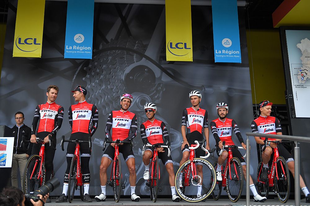 Richie Porte stands on stage with his Trek-Segafredo teammates at the opening stage at the Criterium du Dauphine