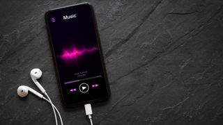iPhone playing music and showing colorful sound wave on screen