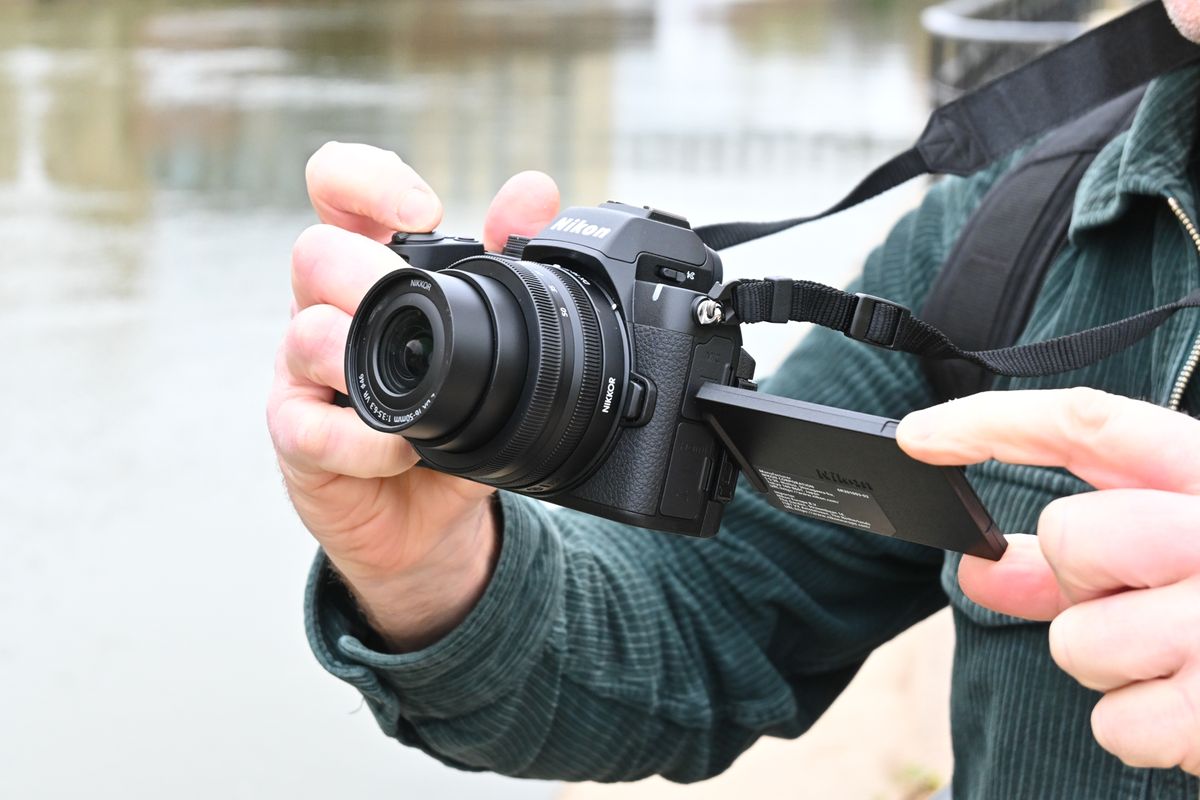 Man holding Nikon Z50 II 