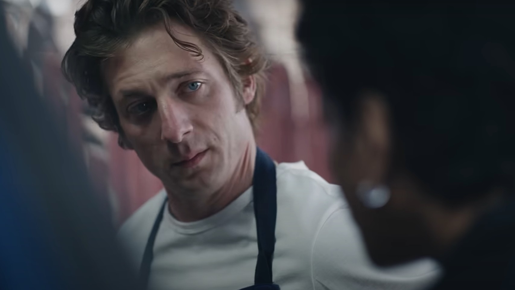 Jeremy Allen White looking at Liza Colon-Zayas in The Bear