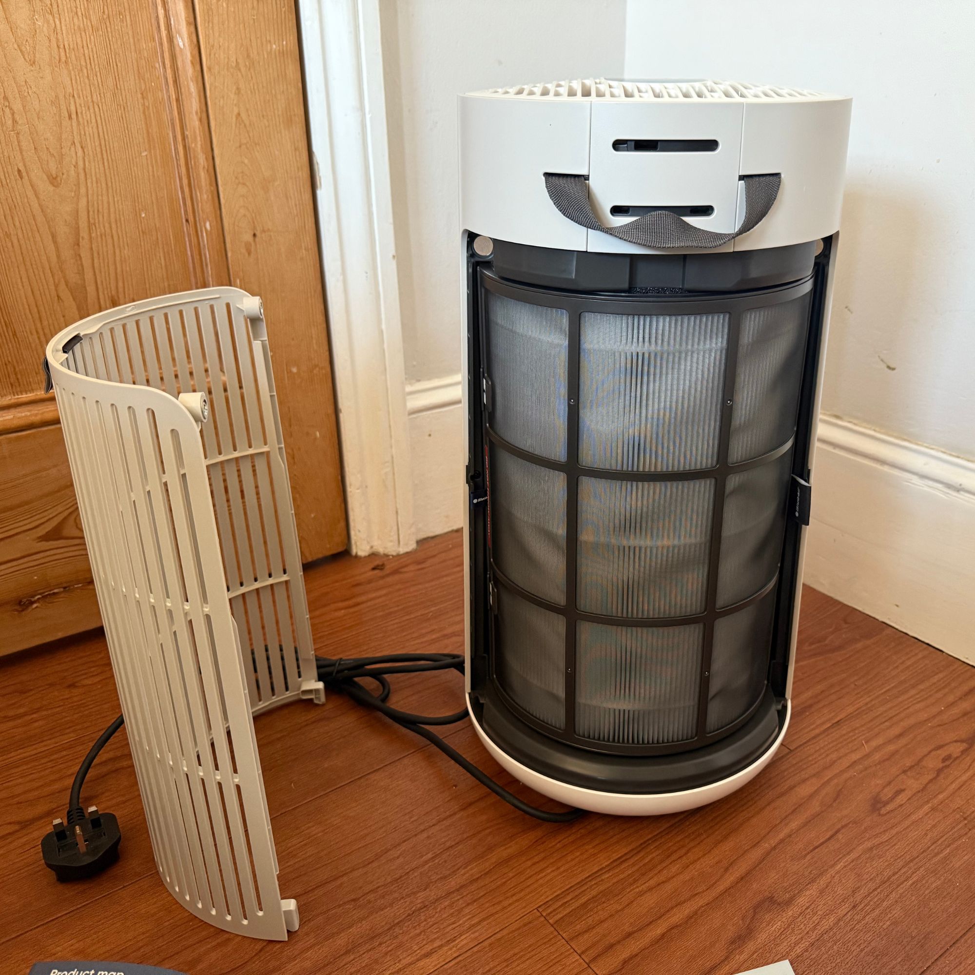 Blueair ComfortPure 3-in-1 T10i Air Purifier with the grate removed to see the filter below
