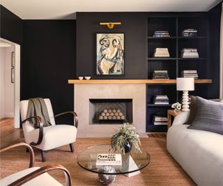Black living room, wooden floor, white armchairs