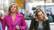Kim Cattrall and Sarah Jessica Parker during Kim Cattrall and Sarah Jessica Parker On Location For "Sex And The City" at Saks Fifth Ave in New York, New York, United States. (Photo by James Devaney/WireImage)