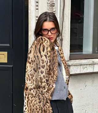 @sobalera wears a leopard-print coat