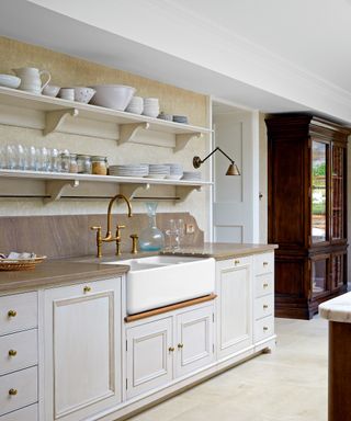 white country style kitchen with butler sink and white cabinets