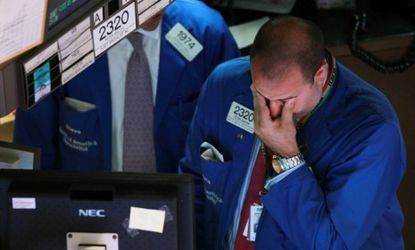 A trader stresses on the floor of the New York Stock Exchange. Sure, the economy is bad, but are we justified in saying we are in a depression?