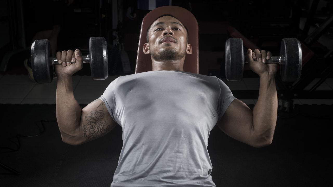 Man training with dumbbells