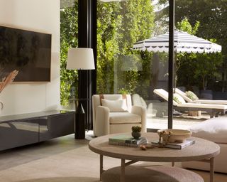 Living room with glass doors and woven coffee table