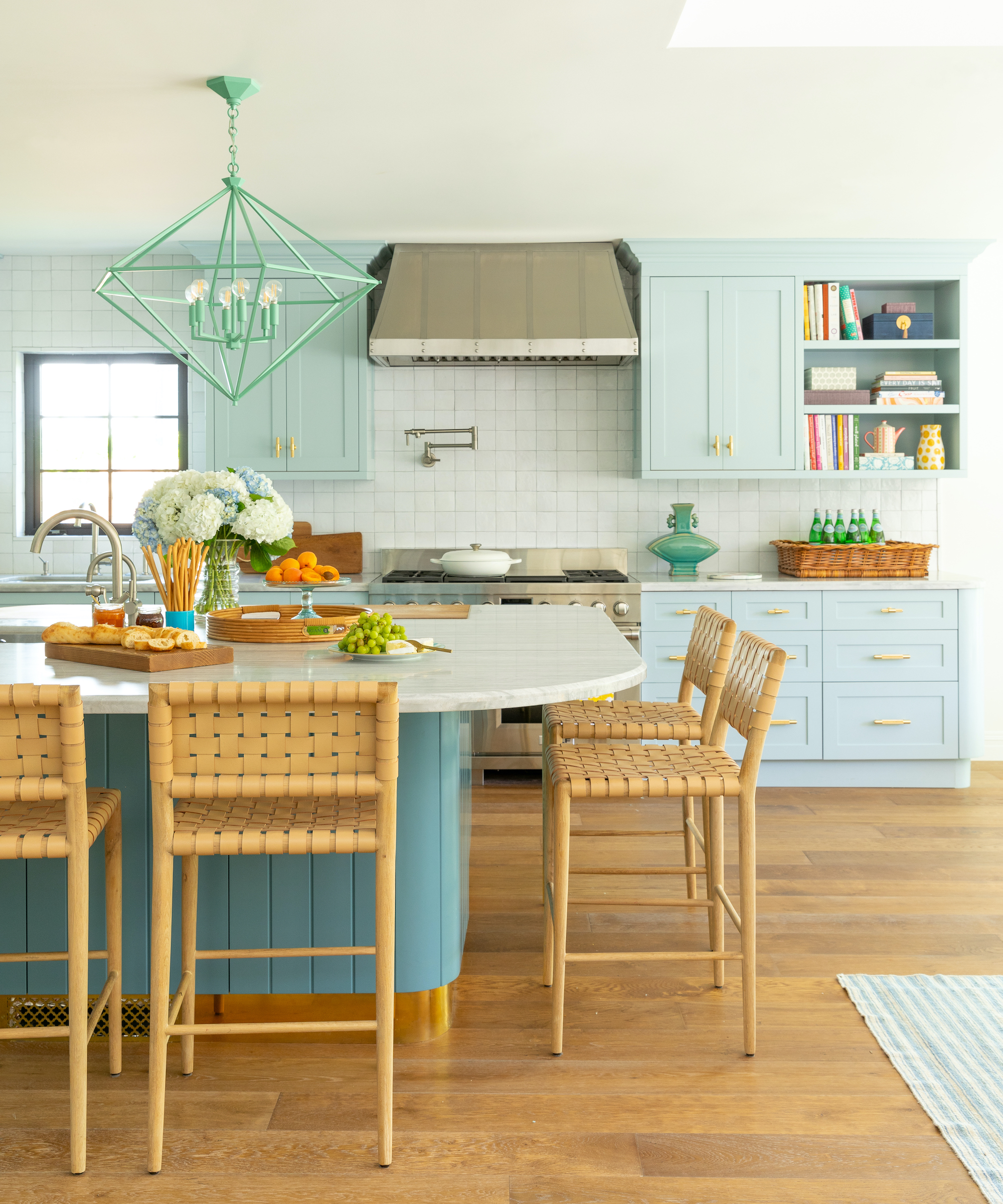 blue kitchen with wood floors