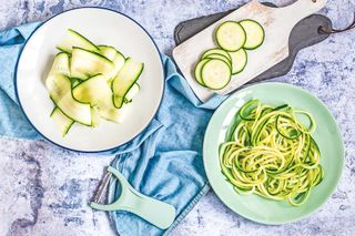 A table with different kinds of courgette - sliced, spiralised and courgetti