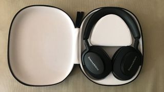 Bowers & Wilkins PX7 S2 in case on brown background
