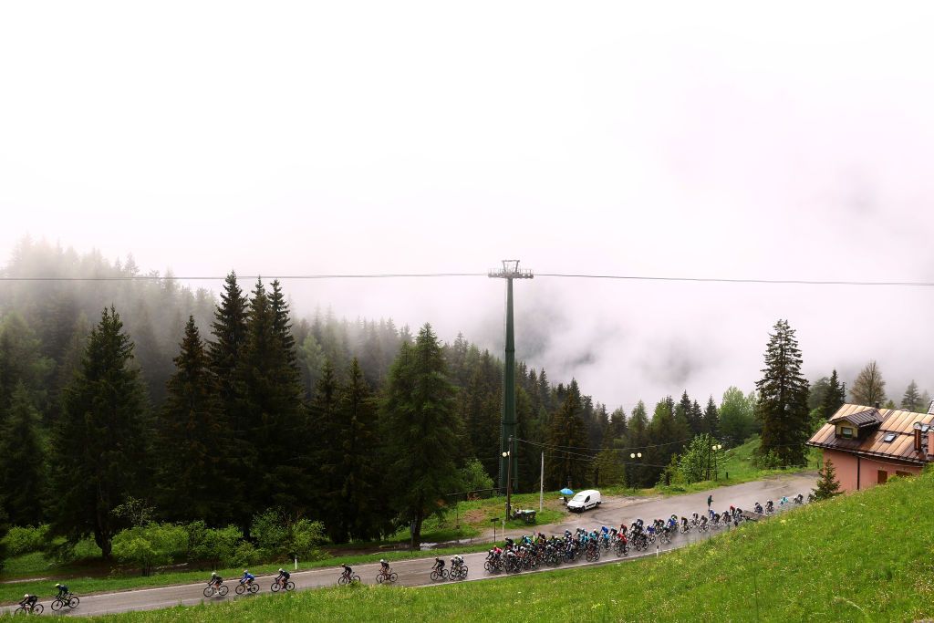 LAVARONE ITALY MAY 25 A general view of the peloton passing through a landscape prior to the 105th Giro dItalia 2022 Stage 17 a 168 km stage from Ponte di Legno to Lavarone 1161m Giro WorldTour on May 25 2022 in Lavarone Italy Photo by Michael SteeleGetty Images