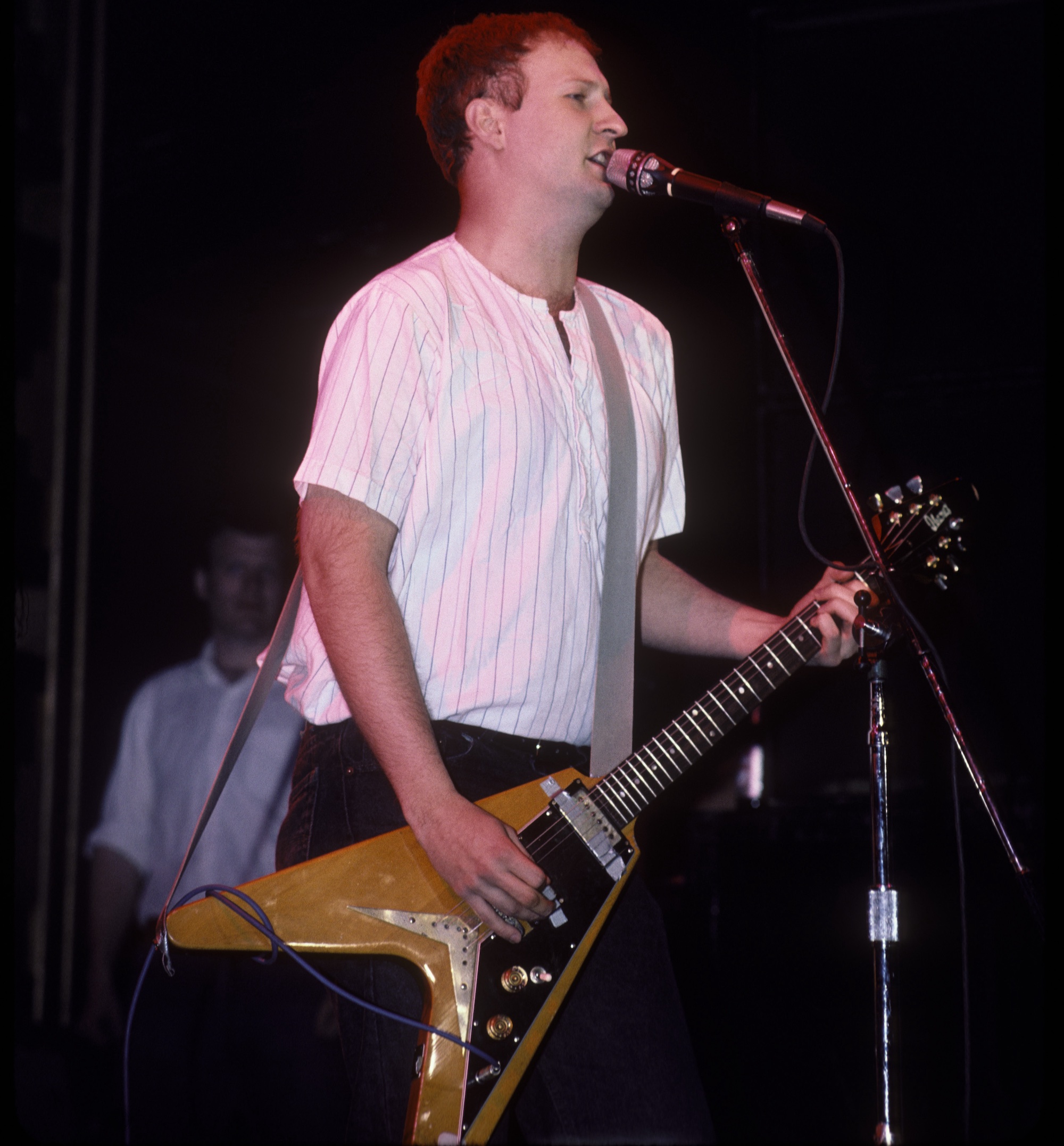Bob Mould performs onstage with Hüsker Dü in 1987