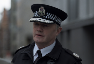 Andrew Whipp as Philip in Six Four, wearing police uniform