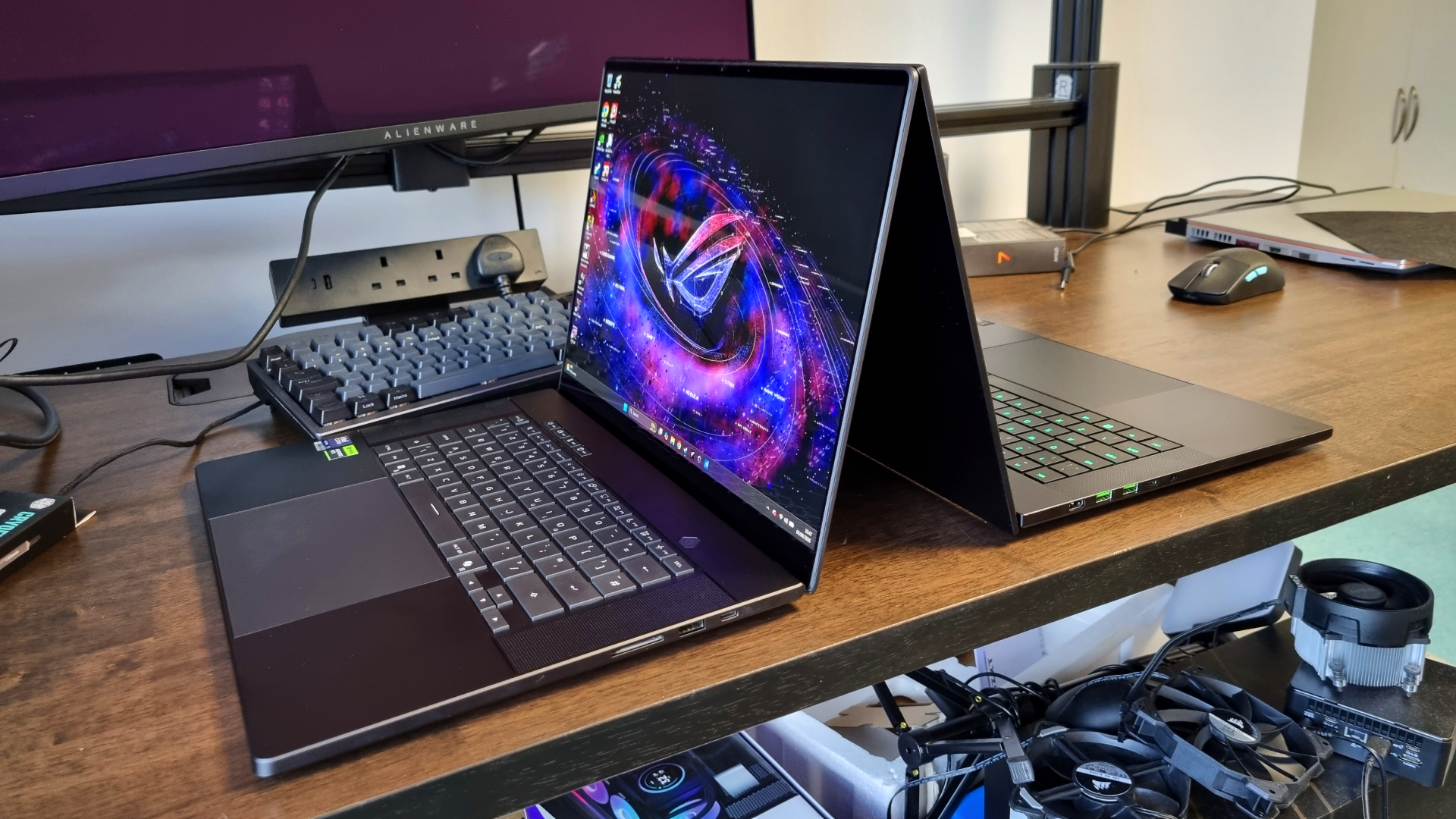 The Asus ROG Zephyrus G16 and the Razer Blade 16 back to back