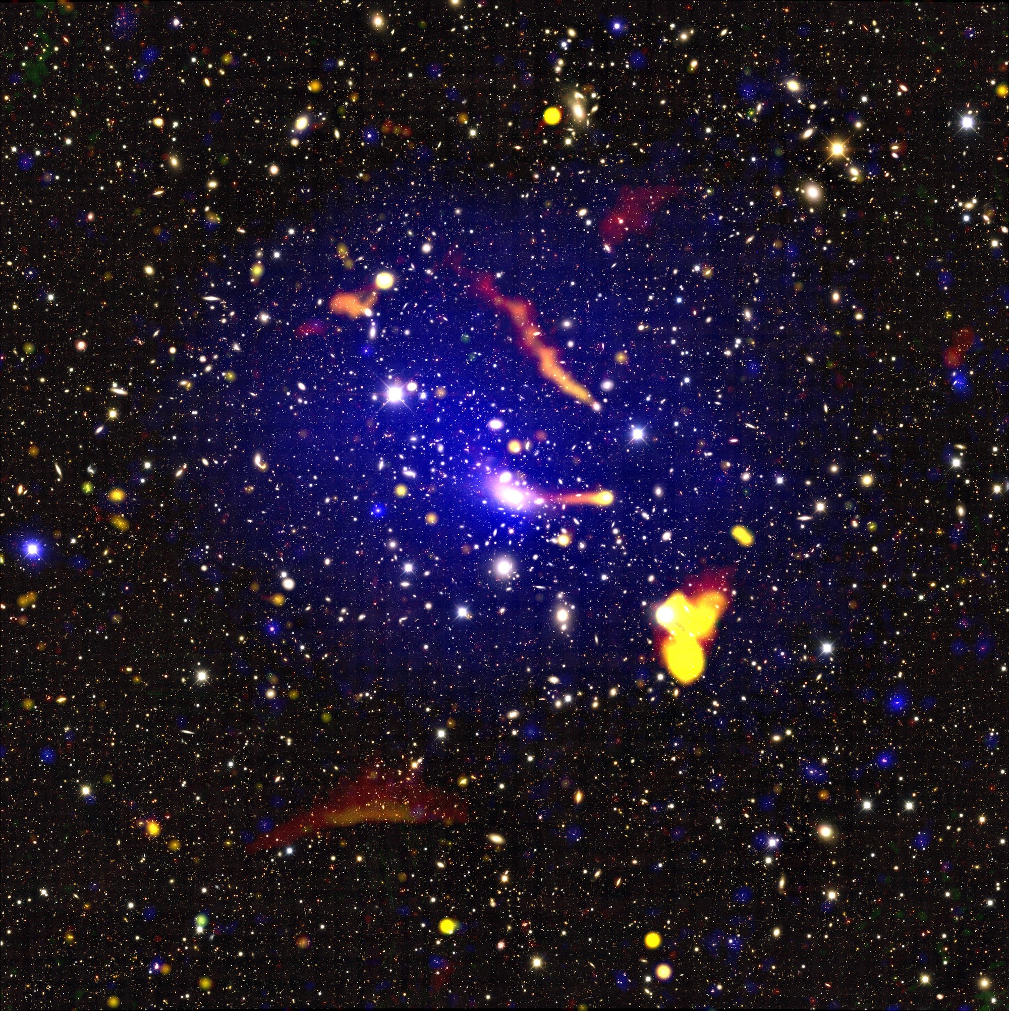 The colliding cluster Abell 3266 as seen across the electromagnetic spectrum, using data from ASKAP and the ATCA (red/orange/yellow colours), XMM-Newton (blue) and the Dark Energy Survey (background map).