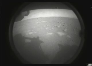This is the first photo NASA's Perseverance rover beamed back to Earth after it landed on Mars on Feb. 18, 2021.