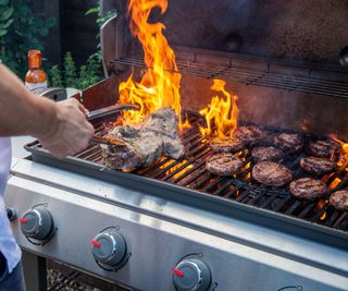 Grilling lamb and burgers on a large gas grill