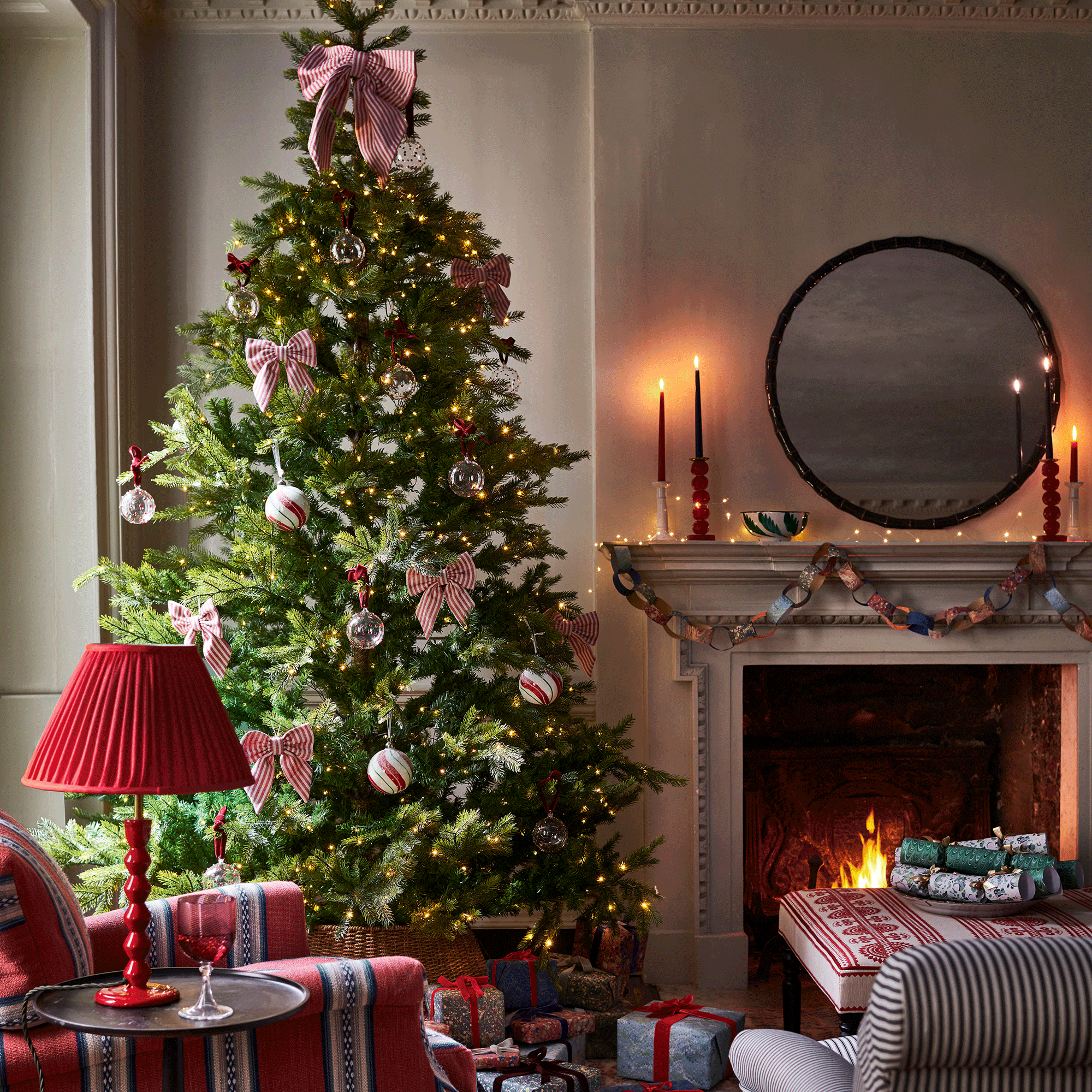 Christmas tree with ribbons in living room 