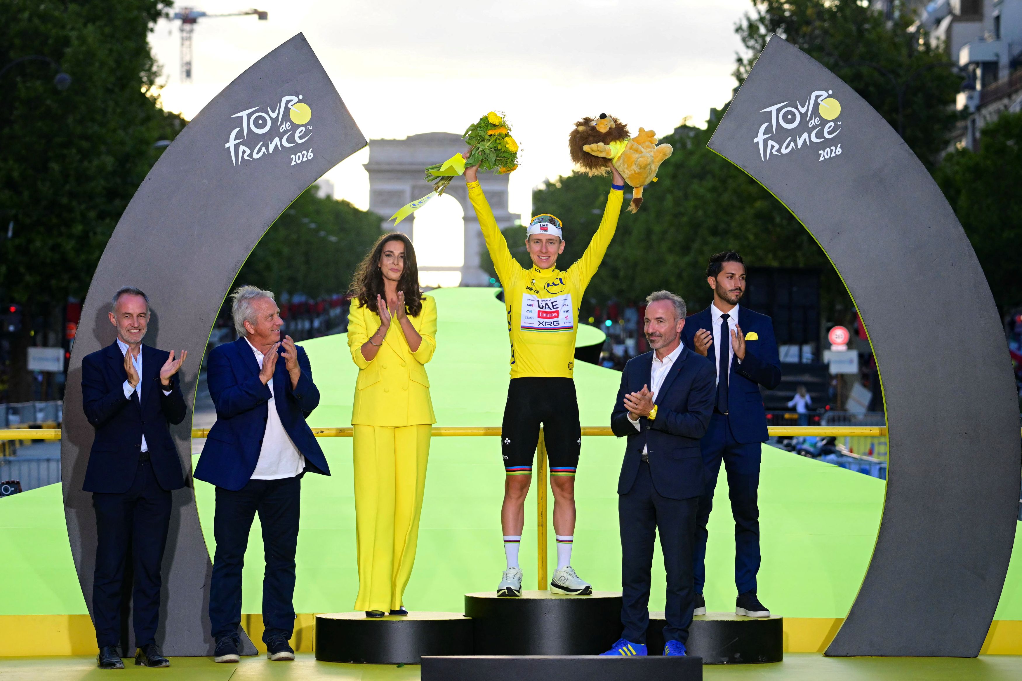 UAE Team Emirates - XRG's Slovenian rider Tadej Pogacar celebrates on the podium with the overall leader's yellow jersey after the 21st stage of the 113th edition of the Tour de France cycling race, 88,7 km starting and finishing in Paris, on July 26, 2026. (Photo by Bernard PAPON / POOL / AFP via Getty Images)