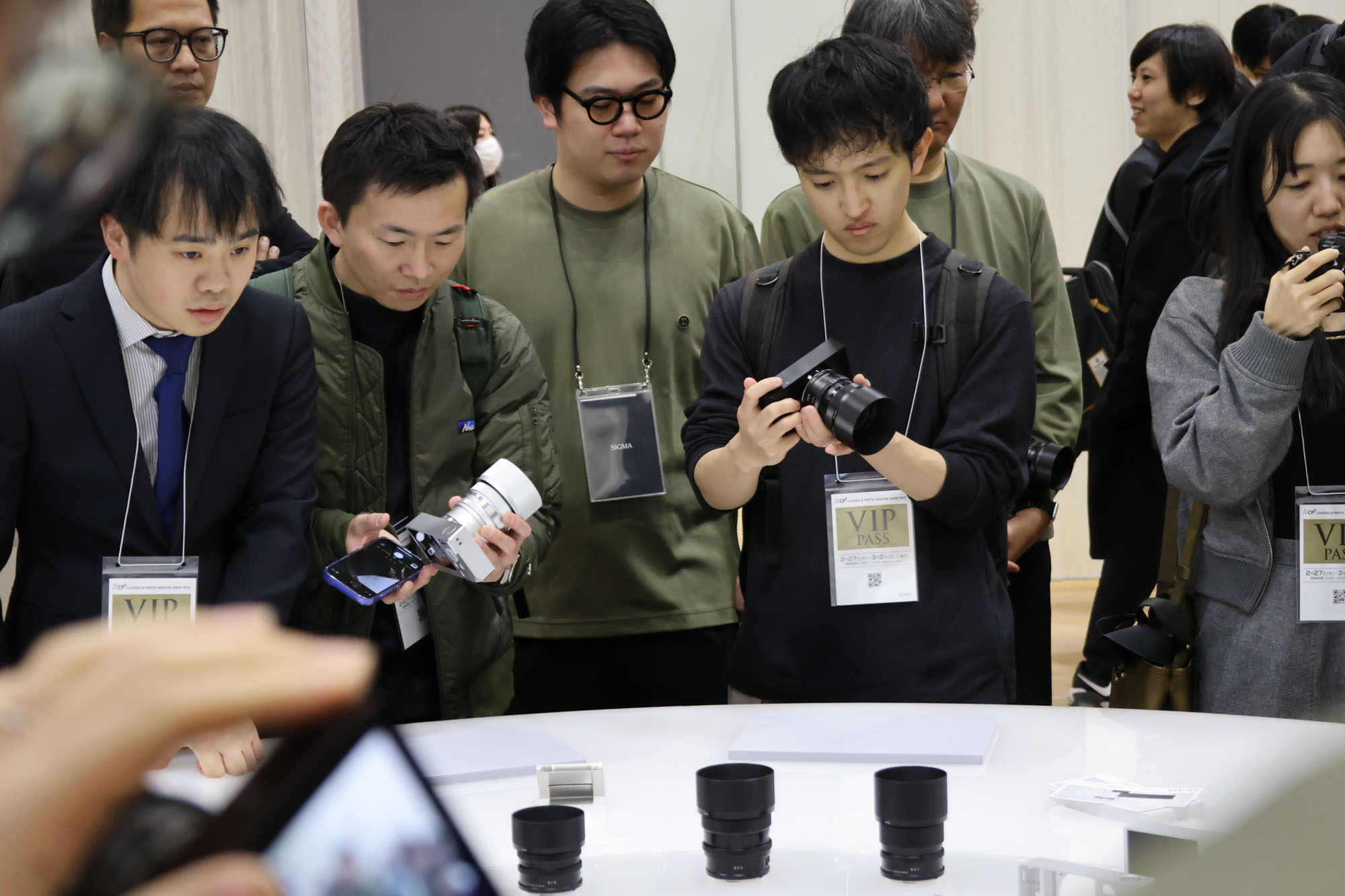 People surrounding the Sigma stand at the CP+ 2025 photography show, getting hands on the BF camera