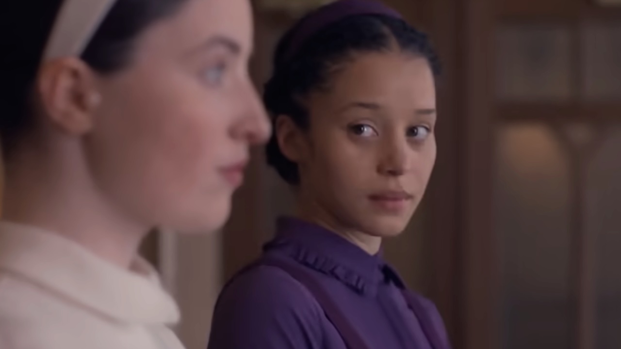 Chase Infiniti looking at Daisy in The Testaments