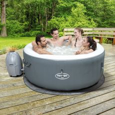 hot tub on wooden flooring in garden