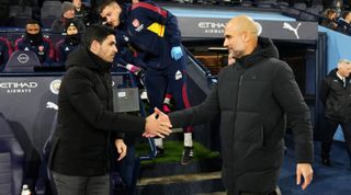 Arsenal manager Mikel Arteta shakes hands with Manchester City manager Pep Guardiola ahead of the Emirates FA Cup fourth round match between Manchester City and Arsenal at the Etihad Stadium in Manchester, United Kingdom on 27 January, 2023.
