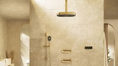 Tiled bathroom with Kohler Anthem shower controls and wall-mounted and overhead showers