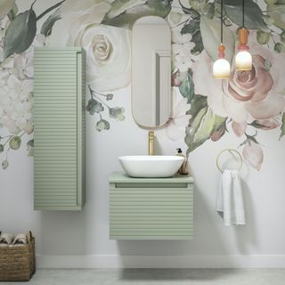 bathroom with floral wallpaper and green wall hung furniture