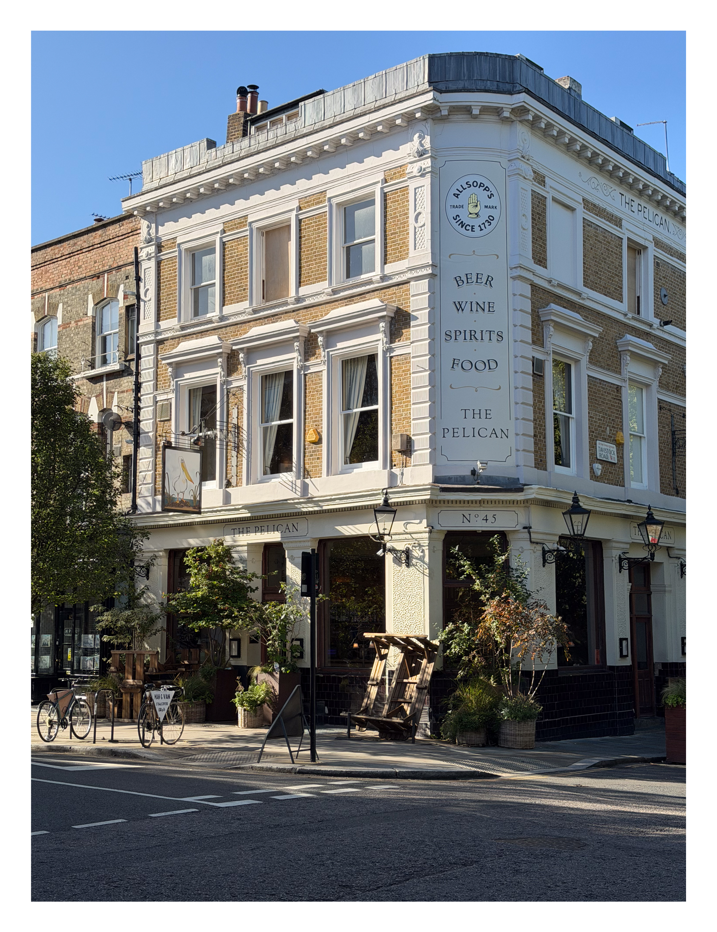 A large pub on the corner of a street in London