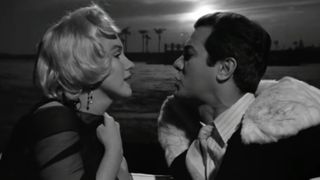 Marilyn Monroe and Tony Curtis escape on a boat in Some Like It Hot