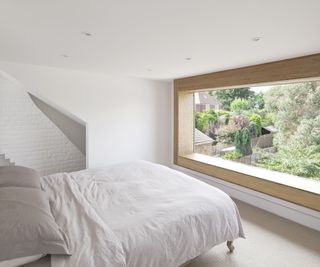 A clean and contemporary bedroom in a loft conversion