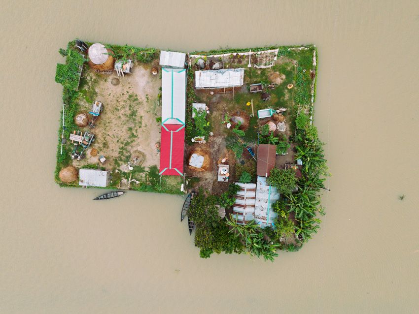 An aerial image of a flooded home in Bangladesh