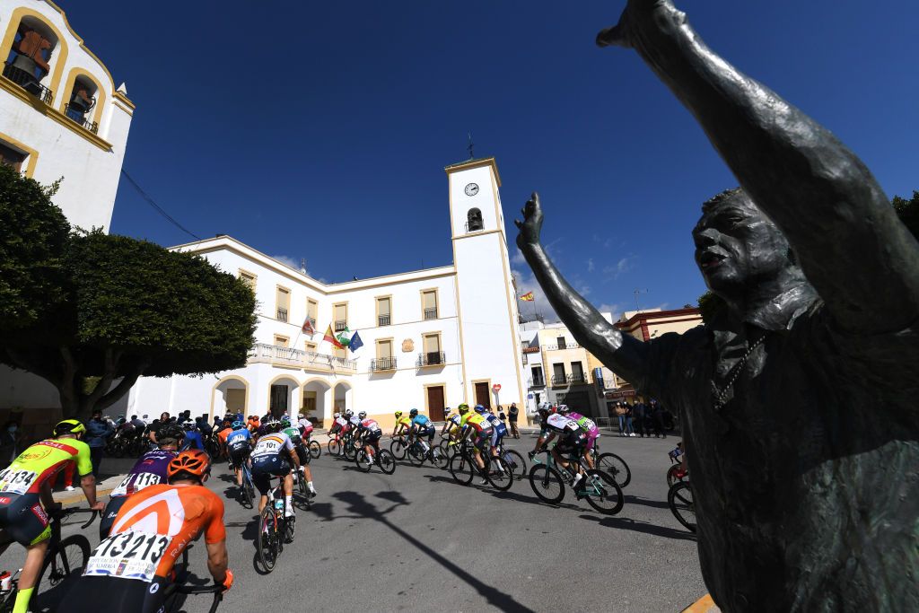 ROQUETAS DE MAR SPAIN FEBRUARY 14 The Peloton during the 34th Clsica de Almeria 2021 a 1833km race from Pueblo de Vicar to Roquetas de Mar Berja Village Landscape Fans Public ClasicaAlmeria21 on February 14 2021 in Roquetas de Mar Spain Photo by Tim de WaeleGetty Images