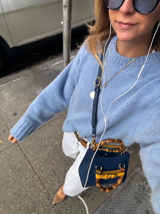 Bailey Burke in a cashmere sweater.