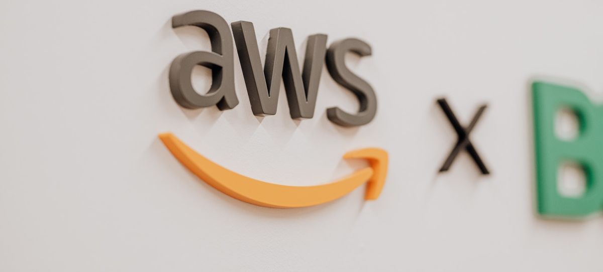 Amazon Web Service&#039;s logo on a wall