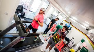 Elite runner on treadmill in heat chamber