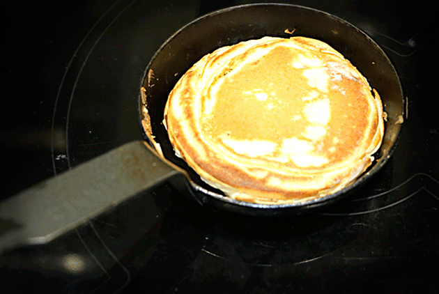 In the small frying pan, the pancake begins to take shape