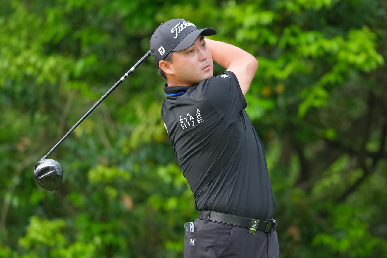 Richard T Lee hits a driver