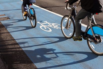 Cyclists use bike lane in London