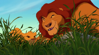 A regal animated lion plays with a cub in the grass