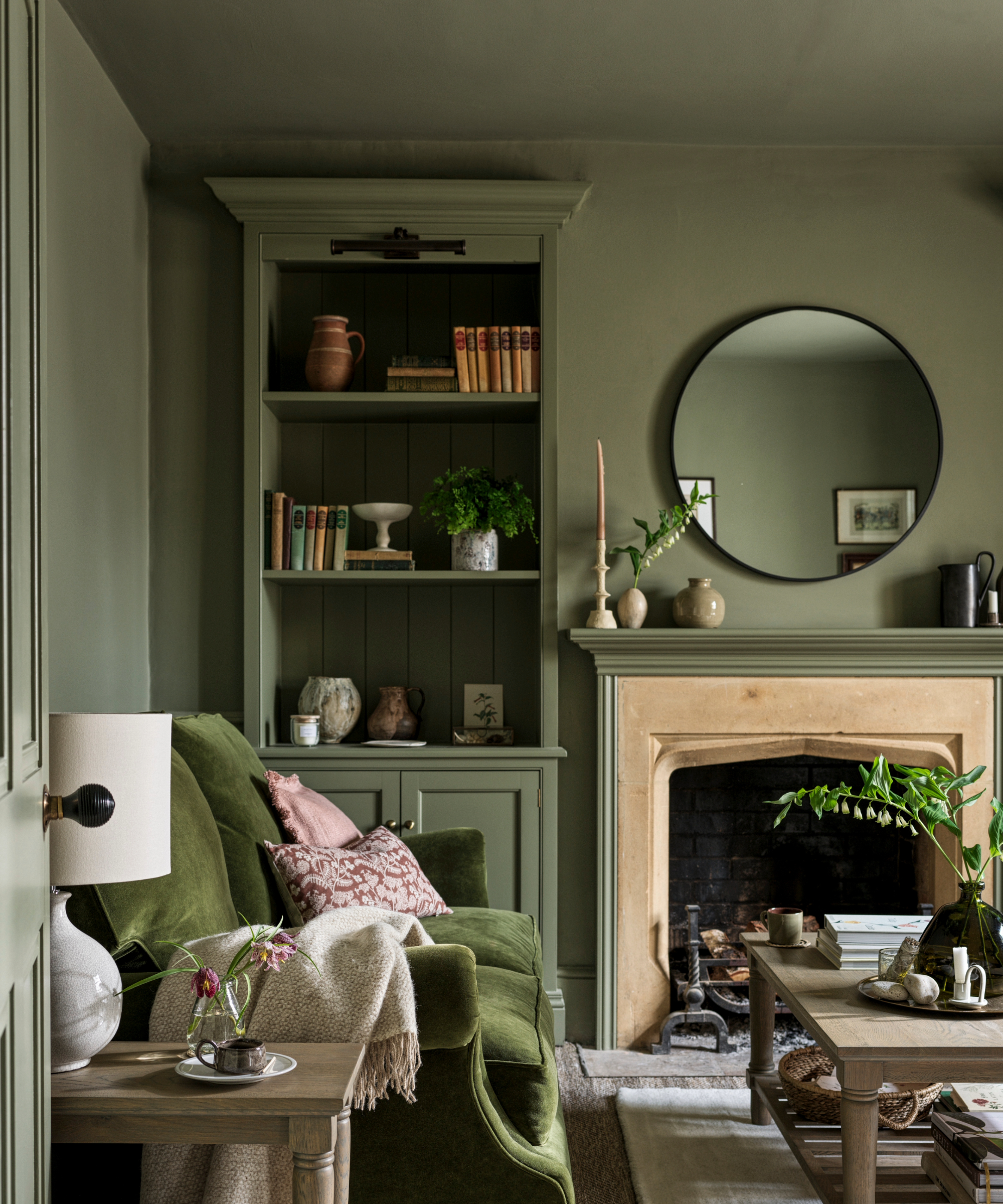 Green living room with painted walls, ceiling and furniture