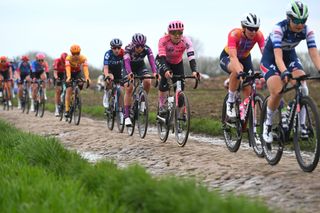 Alison Jackson and her breakaway companions race across the cobbles