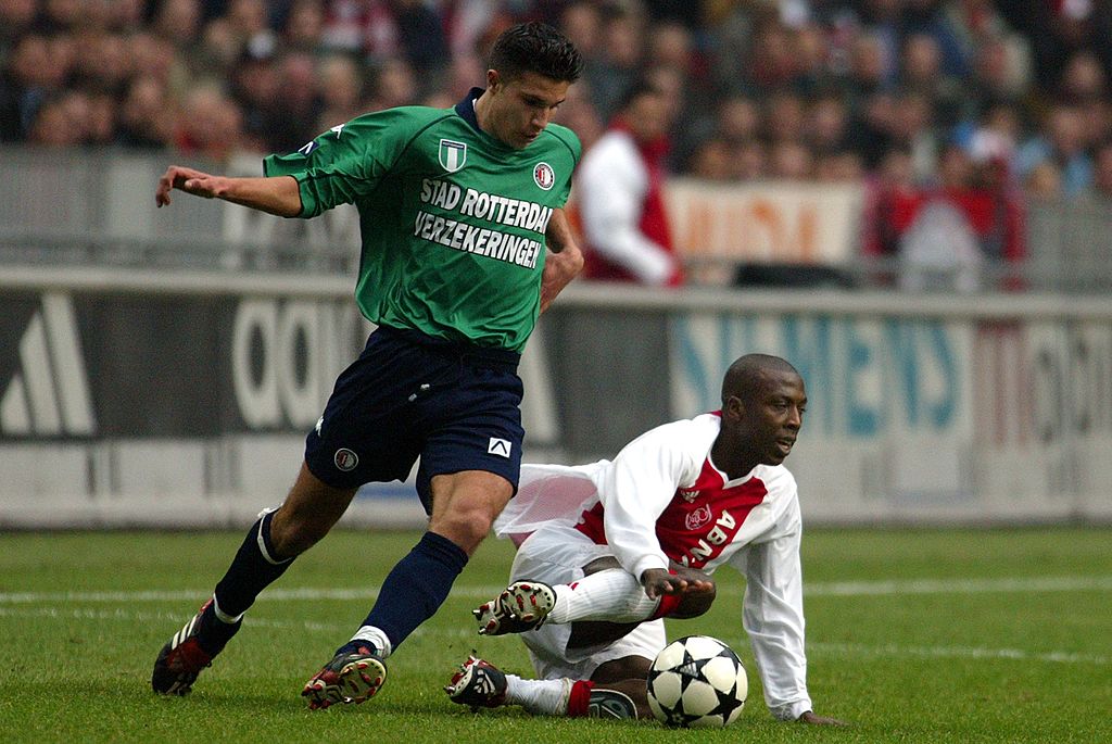 Robin van Persie (L) Hatem Trabelsi (R) during the Dutch eredivisie match between Ajax and Feyenoord on February 9, 2003 at the Amsterdam Arena at Amsterdam, Netherlands.(Photo by VI Images via Getty Images)