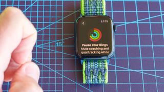 Close-up of the Apple Watch SE 2022 and Apple's Activity app where you can now pause Rings