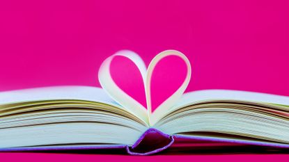 Opened book, pages shaped to form a heart