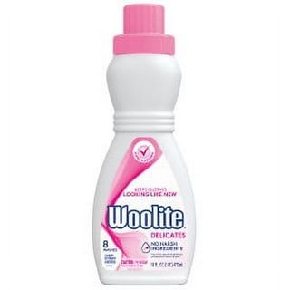 A white plastic bottle of woolite laundet detergent with a pink tlabel and screw top lid