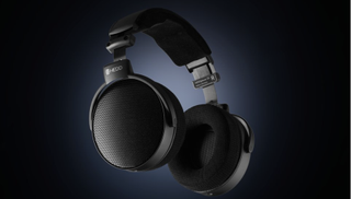 HEDD D1 headphones in black, on a dark and backlit background