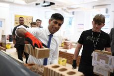 Rishi Sunak lays a brick during a workshop at Cannock College to promote apprenticeships and support from the Tories